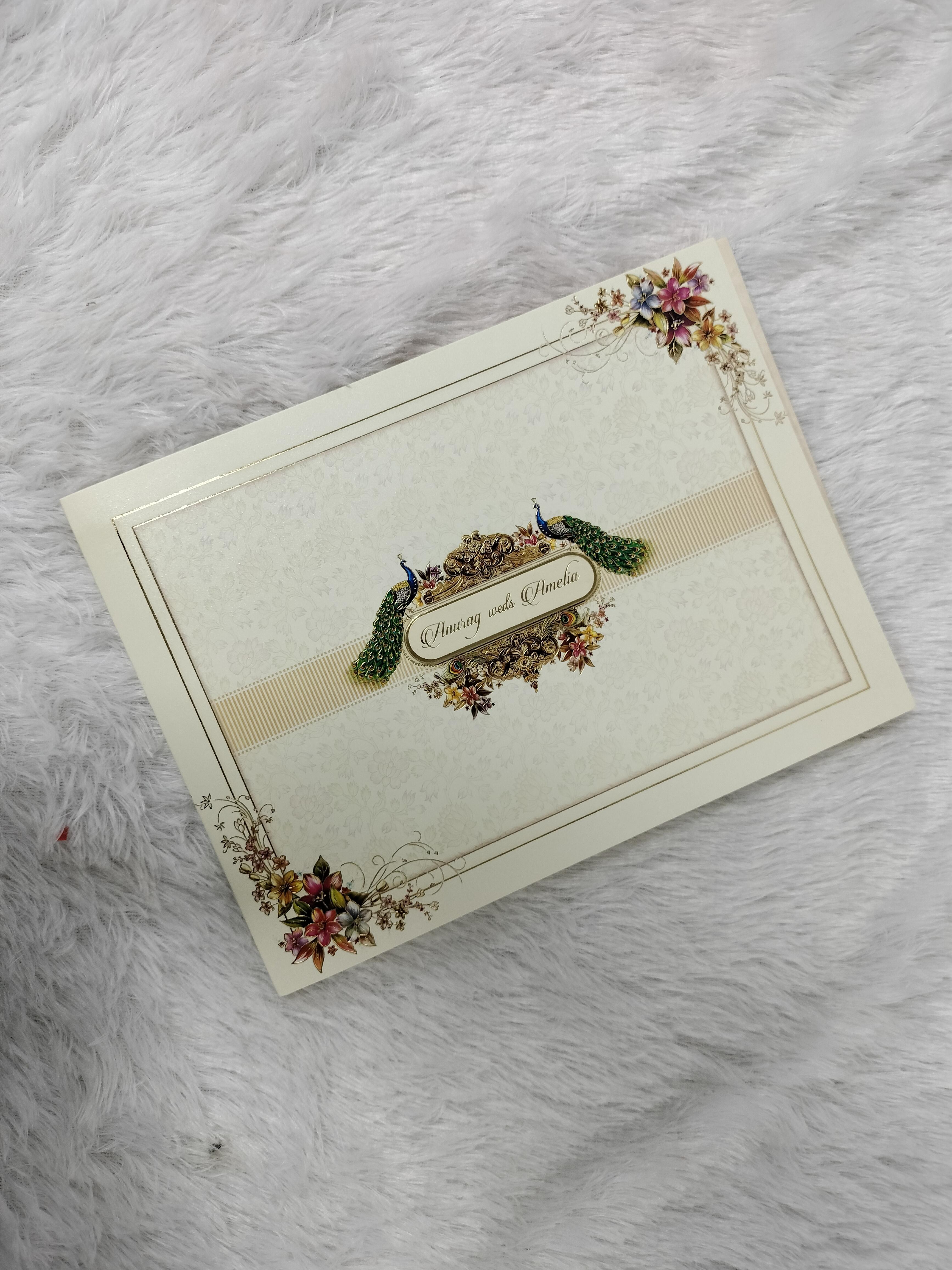 Cream Landscape Wedding Invitation Card with Peacock Motifs and Floral Corners ("AC-114")