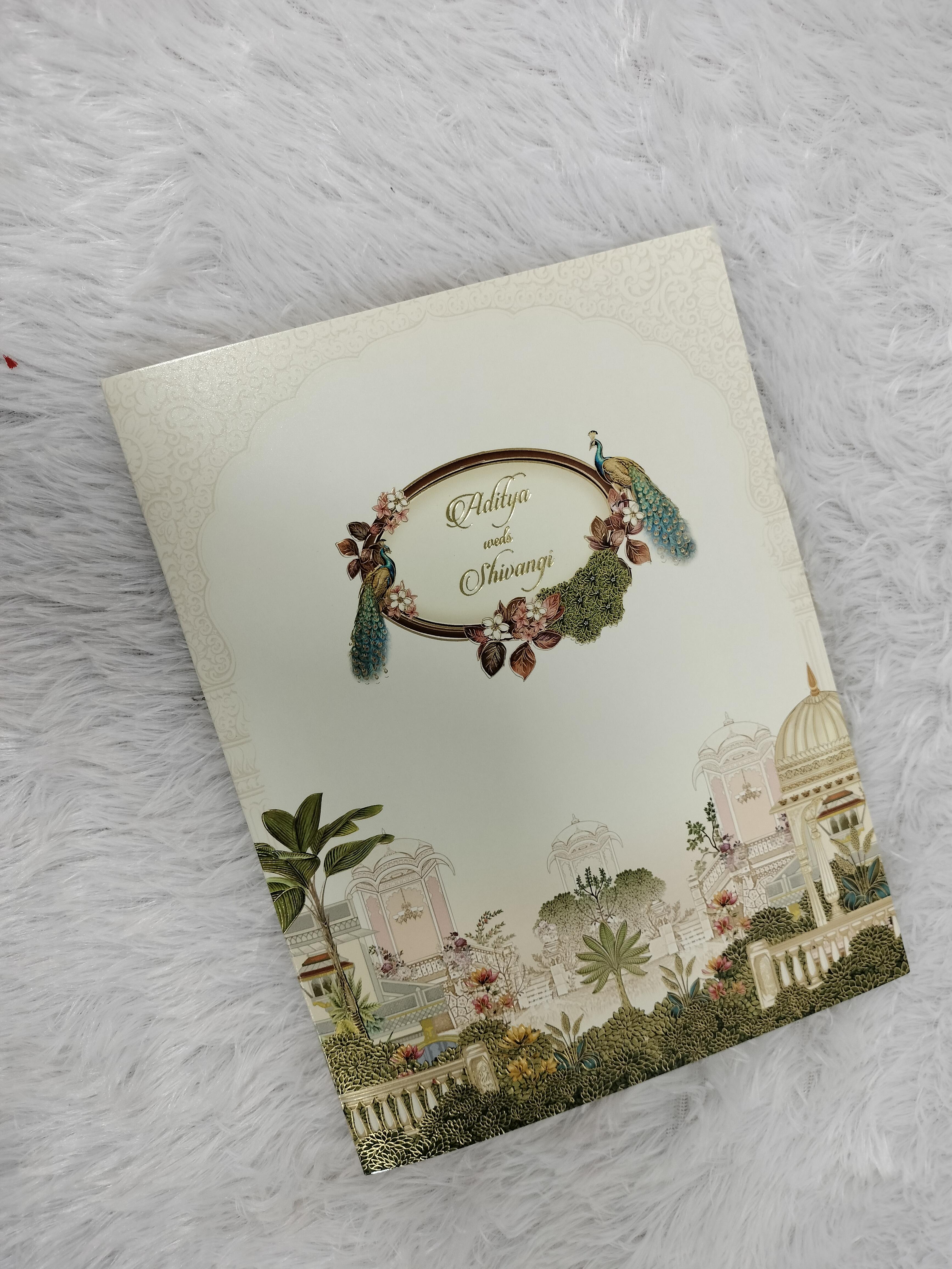 Cream Wedding Invitation Card with Peacock Motif and Indian Heritage Palace Artwork ("AC-519")