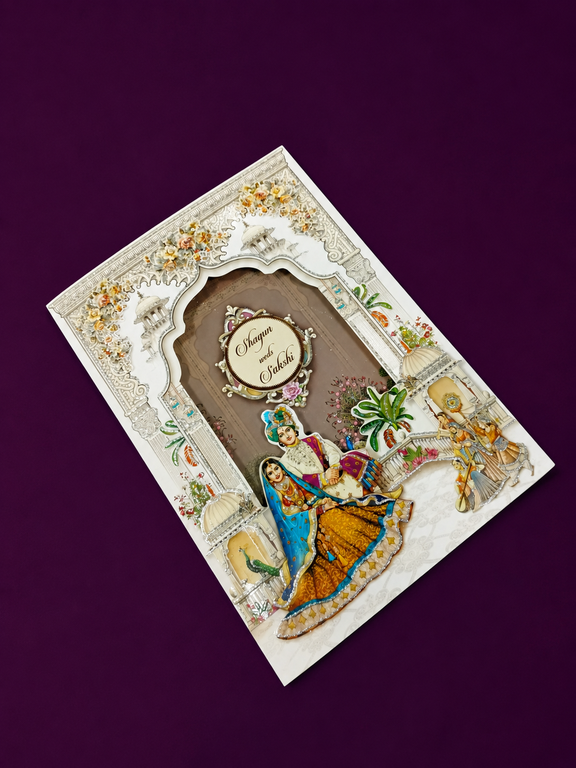 Royal Rajasthani Couple Wedding Invitation Card with Palace Window and Personalised Medallion (543)